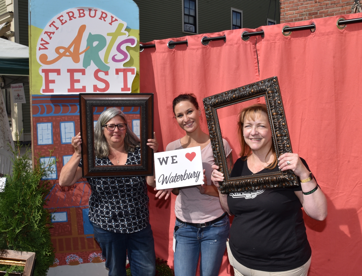 Attendees taking a picture at the selfie station